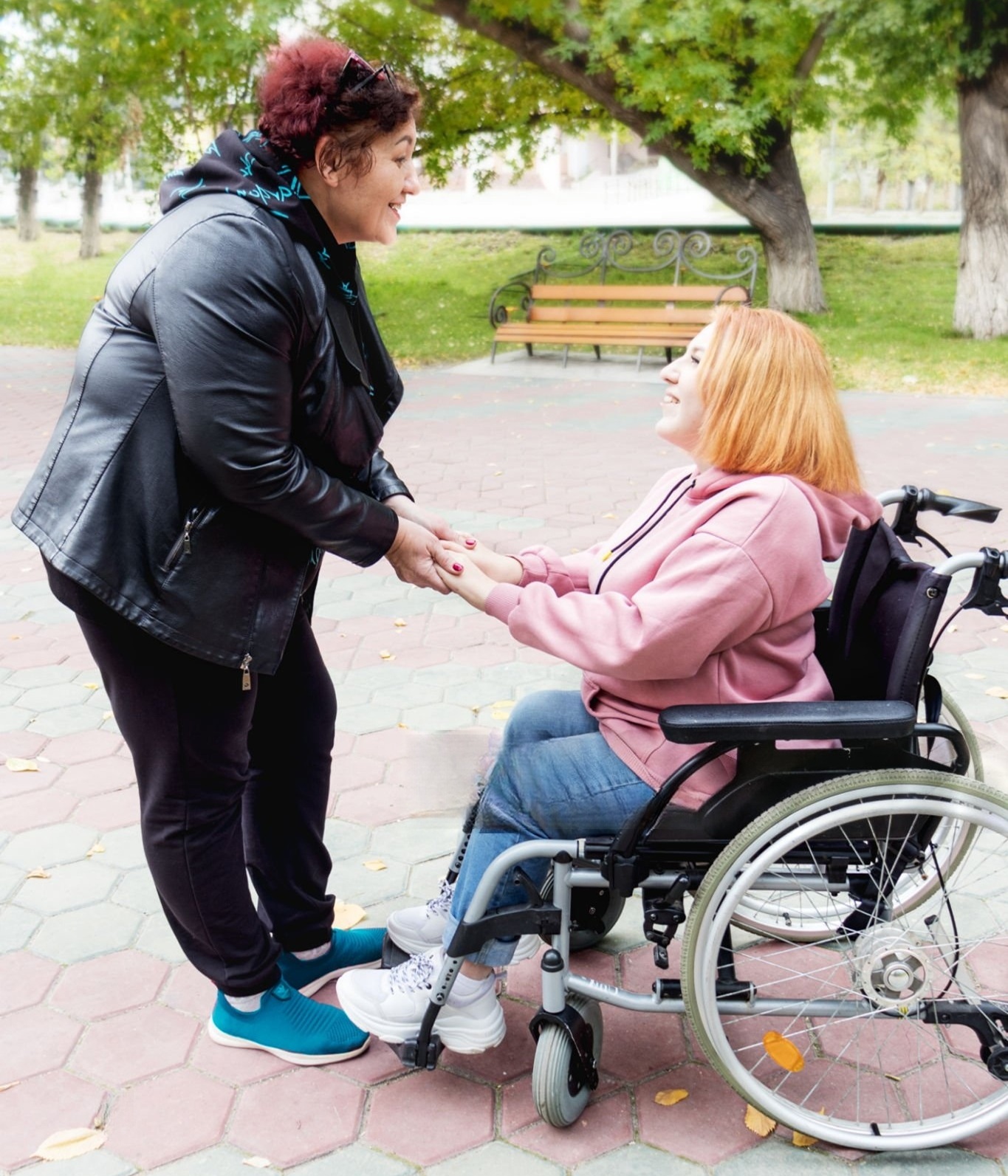 Loving Strive LLC staff member with a family discussing care options in New Jersey